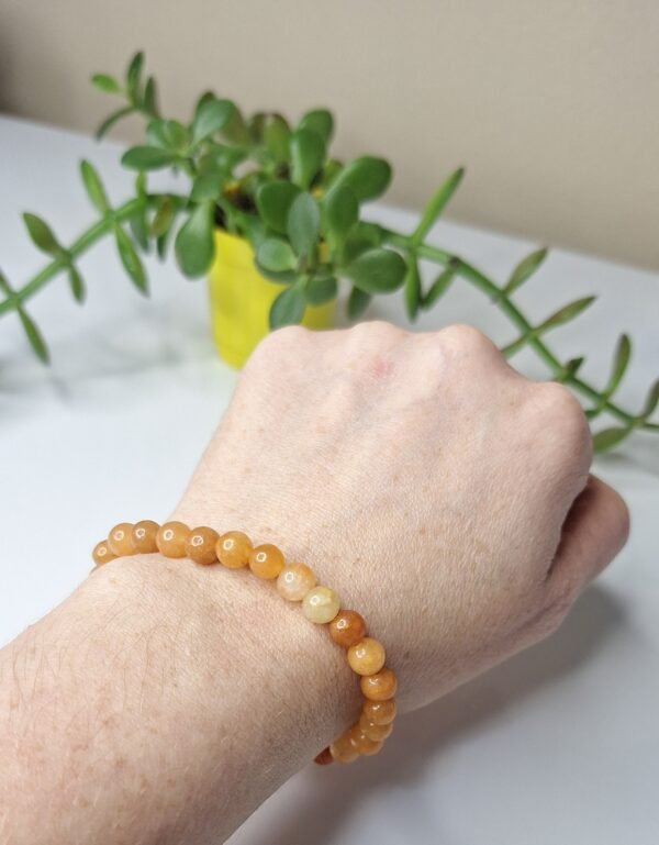 Pulseira de Calcita Laranja 6mm - Energia Solar e Criatividade