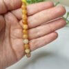 Pulseira de Calcita Laranja 6mm - Energia Solar e Criatividade