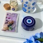 2025/09/1000245061.jpg 🧿 Kit Olho Místico – Proteção Kit 7 Pedras da Sorte + Caneca de Vidro Olho Grego 230ml+ Vela Olho Grego + Sabonete Exclusivo Olho Grego(com energia Reiki)